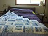 Click image for larger version

Name:	cat quilt on bed.jpg
Views:	381
Size:	80.1 KB
ID:	421404