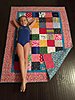 Click image for larger version

Name:	Emily and her finished quilt.jpg
Views:	1209
Size:	46.5 KB
ID:	516952