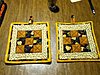Click image for larger version

Name:	black and gold potholders.JPG
Views:	2387
Size:	375.4 KB
ID:	538319